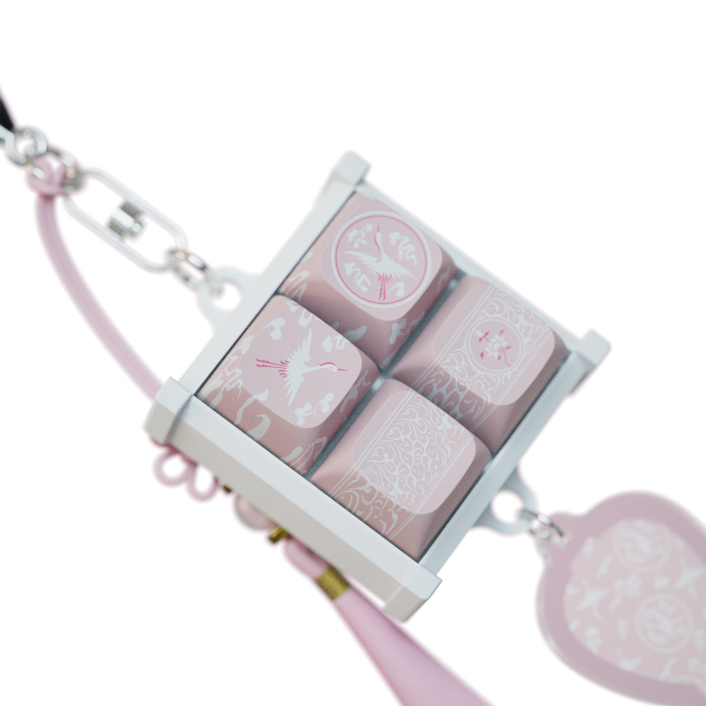 Bloom Celadon keycap keychain and vase charm laid flat